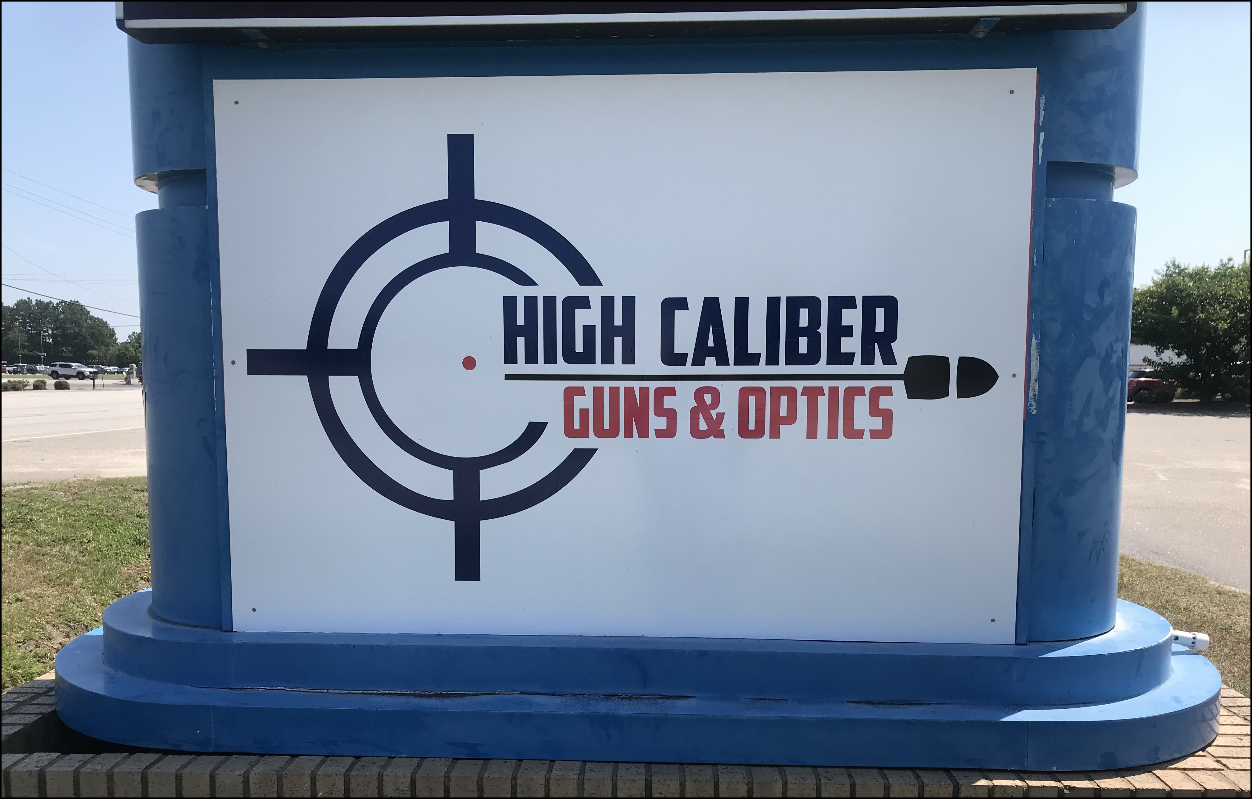 High Caliber Guns and Optics Sign